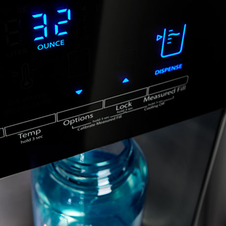 Water dispenser with digital display reading 32 ounces.